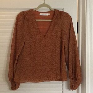 Floral rust/orange colored top